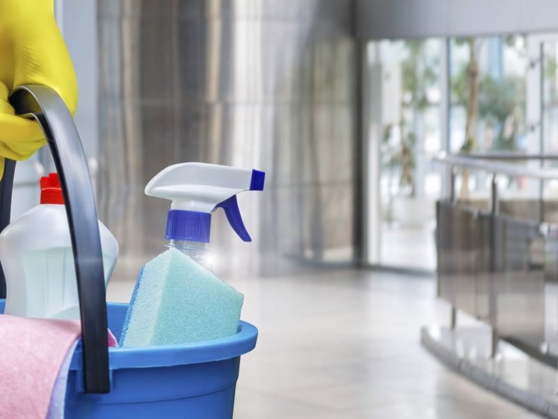 Cleaning lady with a bucket and cleaning products . Cleaning lady with a bucket and cleaning products before washing the floor.
